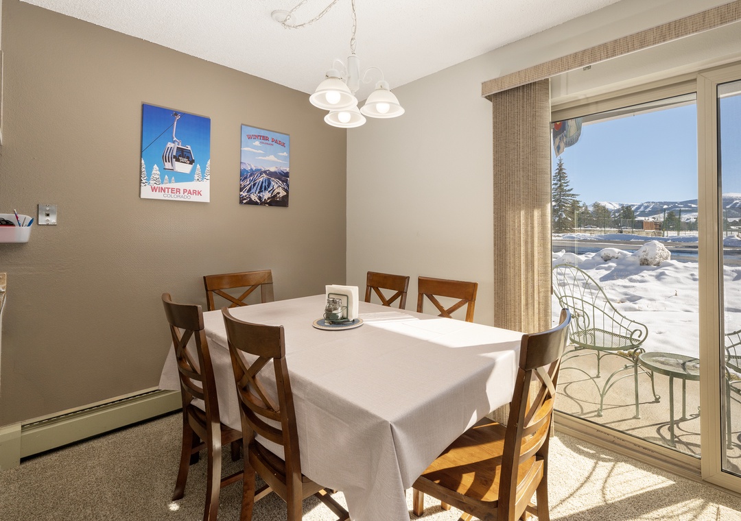 Gather around your dining table for hearty meals, with stunning snow-capped mountains visible through the window.