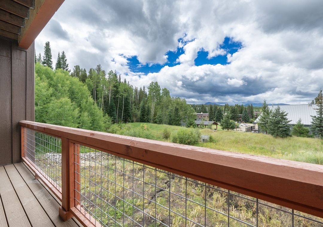 Step onto your private balcony and breathe in the fresh mountain air while enjoying expansive views of lush forests and meadows.