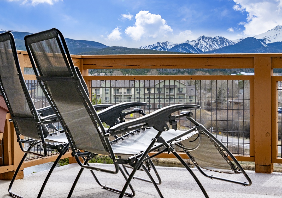 Unwind in comfortable lounge chairs on your private balcony, where stunning mountain vistas create the perfect backdrop for morning coffee or evening relaxation.