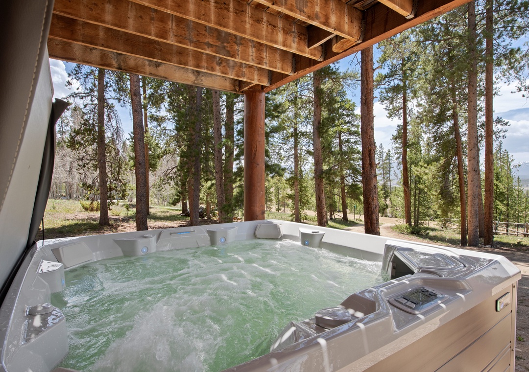 Soak under the stars in your private hot tub, where towering pines frame mountain views and the bubbling jets melt away every care.