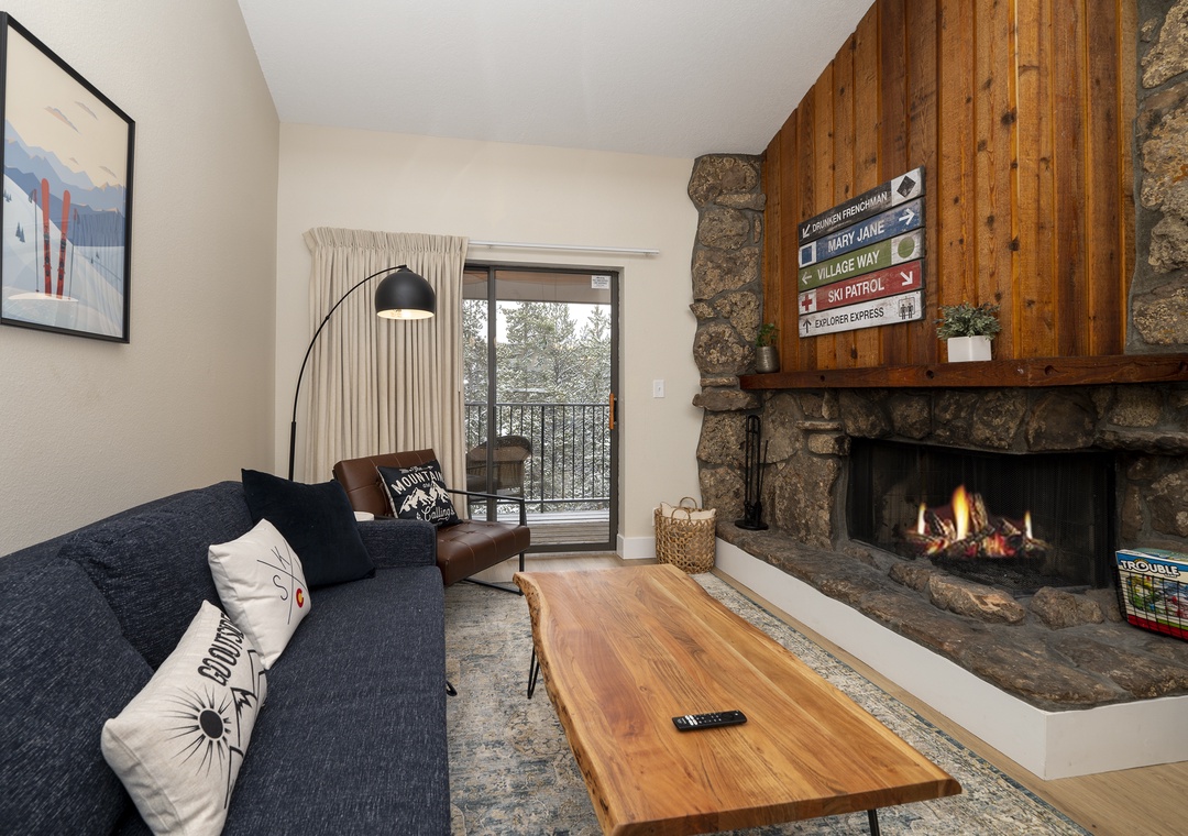 Cozy up by your crackling stone fireplace with mountain views from your private balcony - the perfect alpine retreat.