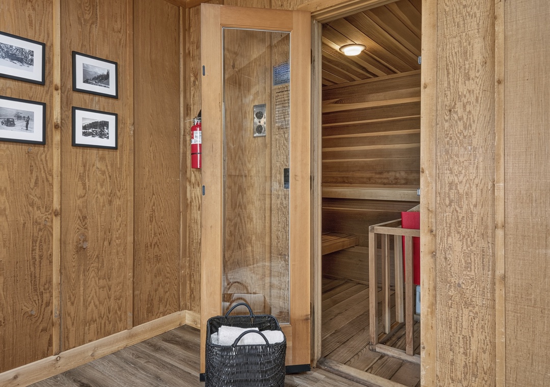Step inside your private sauna and let the warmth melt your stress away. Fresh towels are ready, and vintage photos add a touch of character to this rustic retreat.