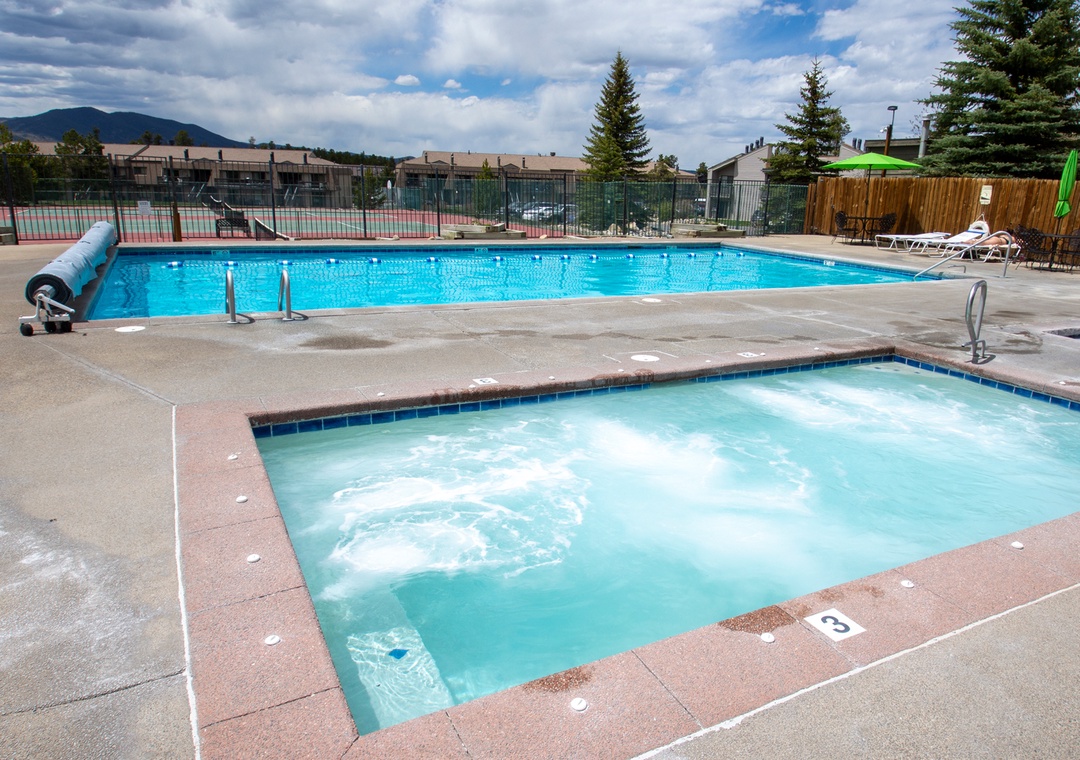 The community offers a heated pool and bubbling hot tub for your relaxation, set against scenic mountain views and open Colorado skies.