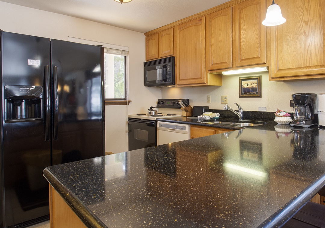 Your fully equipped kitchen features granite countertops, stainless steel appliances, and everything you need to prepare memorable meals during your stay.
