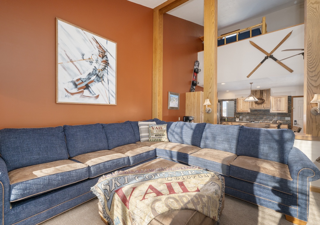 Cozy up in this alpine-inspired living room at Mountainside B-20 where rustic charm meets comfort—your perfect après-ski retreat.