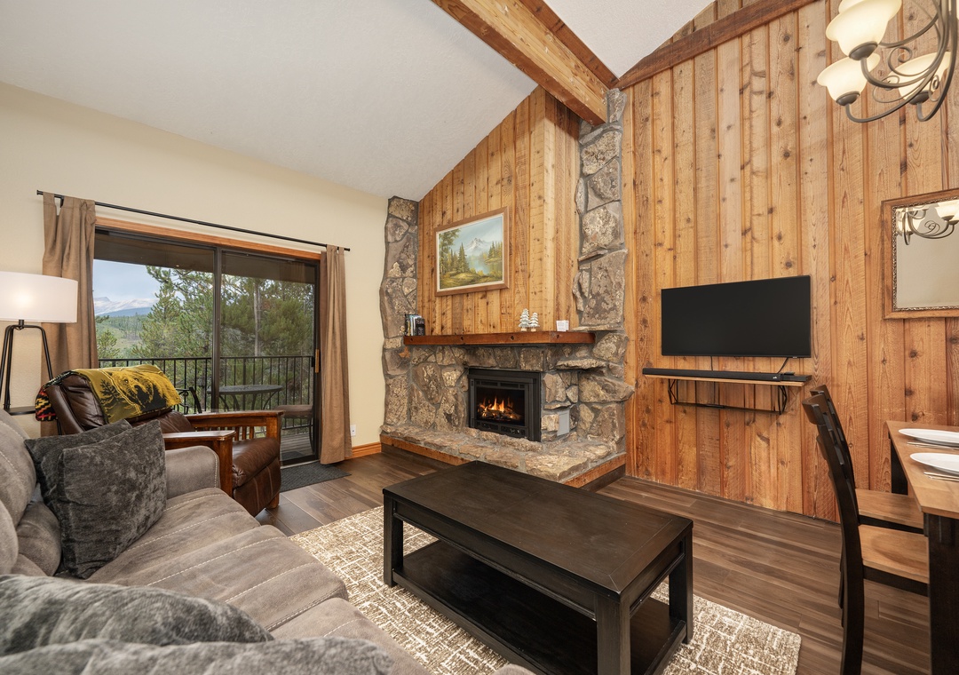 Cozy up by your crackling stone fireplace while enjoying mountain views through your private balcony doors.