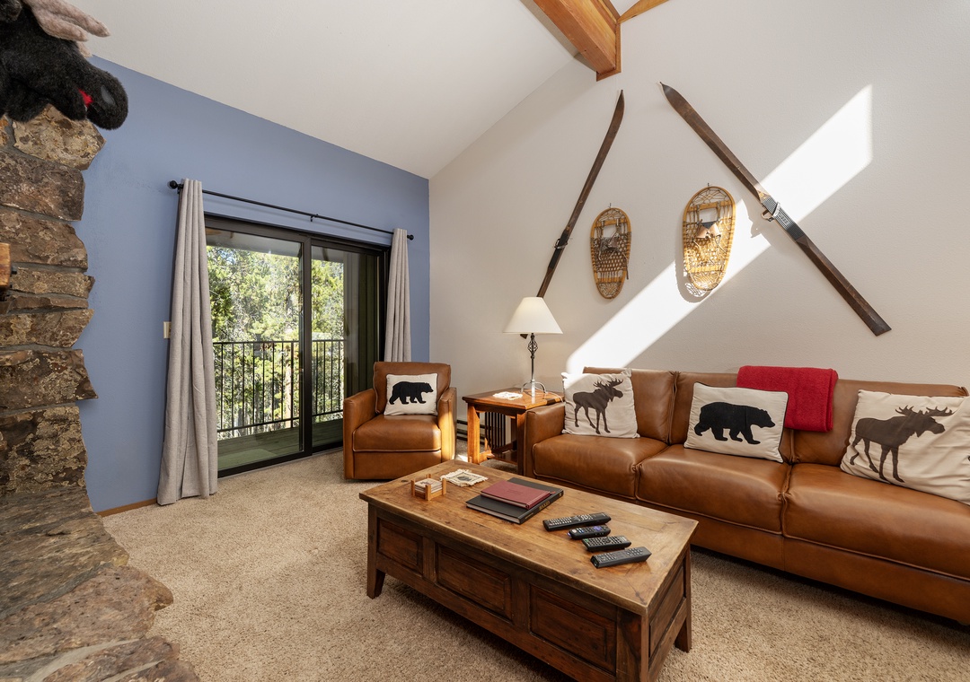 Unwind in your cozy mountain retreat with rustic charm, leather seating, and wildlife-themed touches that bring the outdoors in.