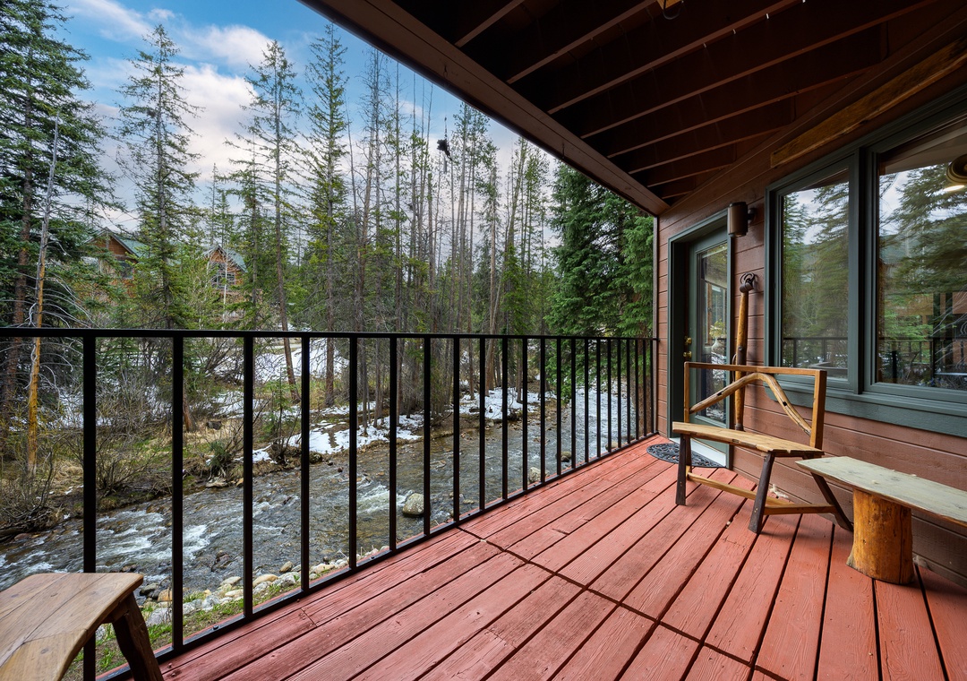 Step onto your private deck and breathe in the crisp mountain air while enjoying peaceful stream views through towering evergreens.