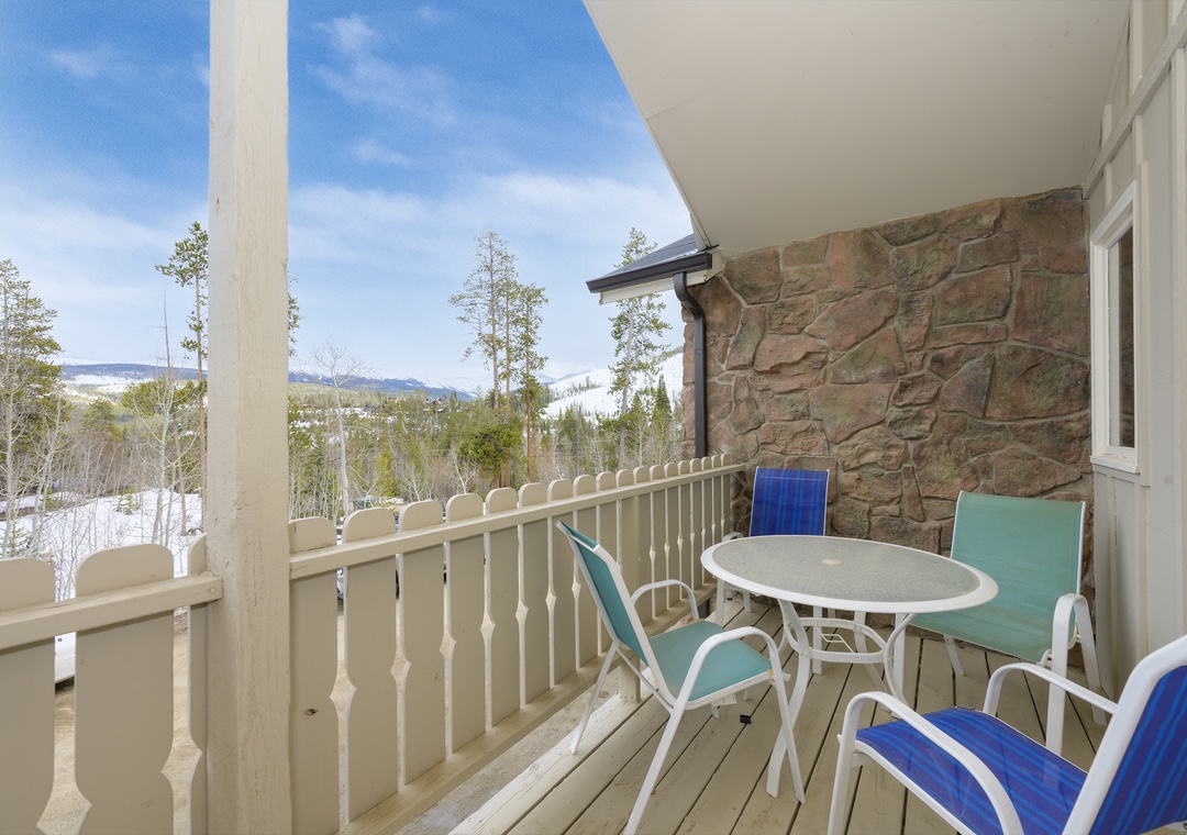 Sip your morning coffee on this peaceful balcony while taking in stunning mountain and forest views.