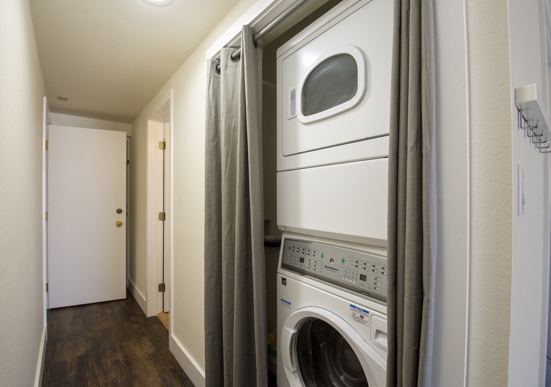 Your private washer and dryer await behind these sleek curtains, making extended stays effortless and comfortable.