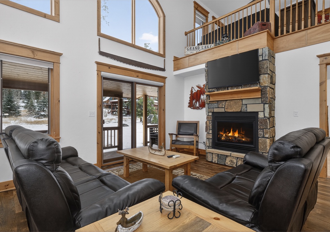 Sink into plush leather recliners at 21 GCR 4435 by your crackling stone fireplace, where soaring ceilings and mountain views create your perfect alpine retreat.