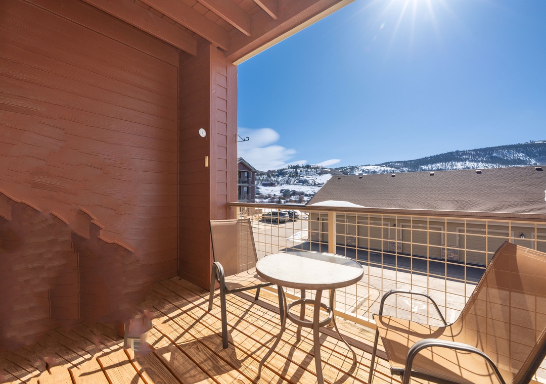 Step onto your private balcony and breathe in the crisp mountain air while taking in stunning views of rolling hills and distant peaks.