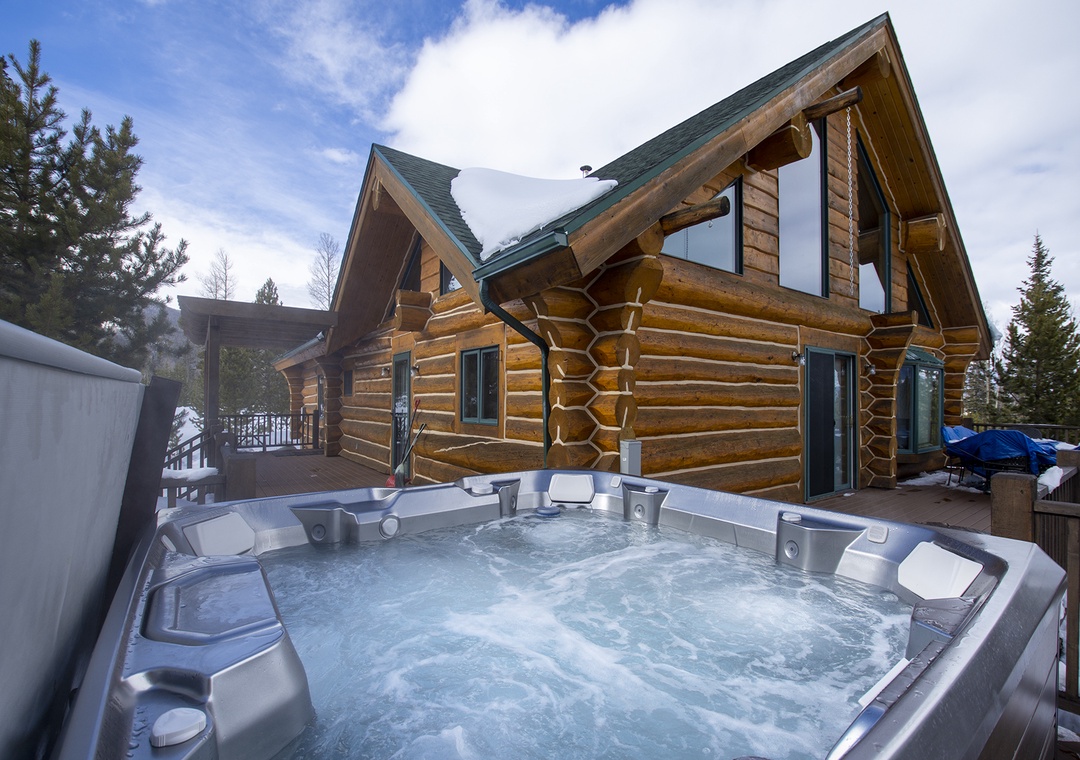 Soak in bubbling warmth while gazing at snow-dusted pines and dramatic mountain skies from your private hot tub.