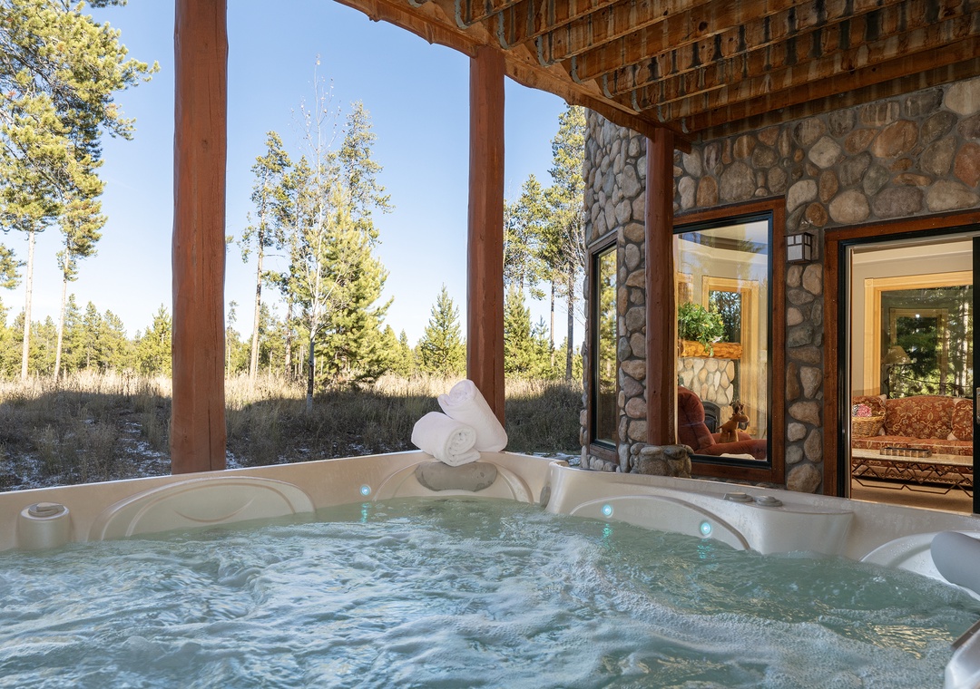 Soak in your private hot tub while gazing at towering pines and open meadows—pure mountain bliss awaits.