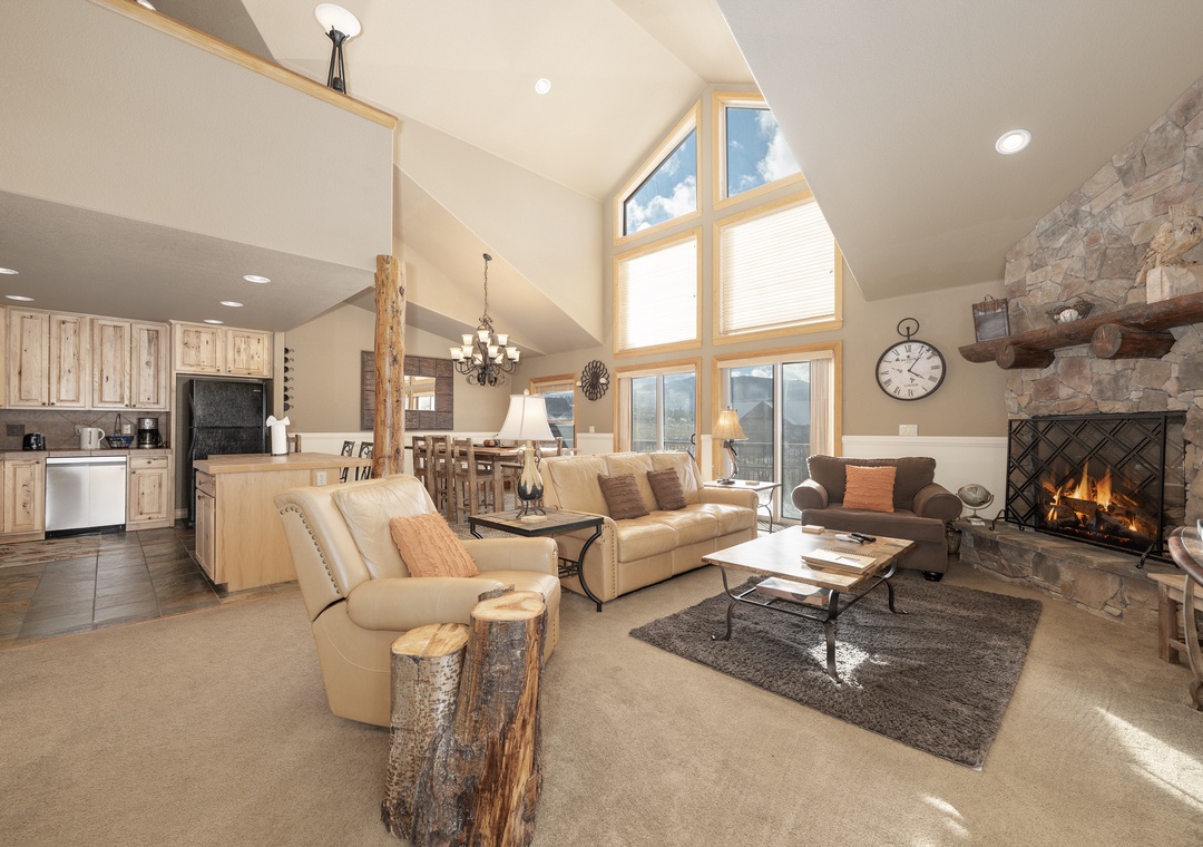 Unwind in your spacious great room where soaring ceilings and a cozy fireplace create the perfect gathering spot for your mountain retreat.