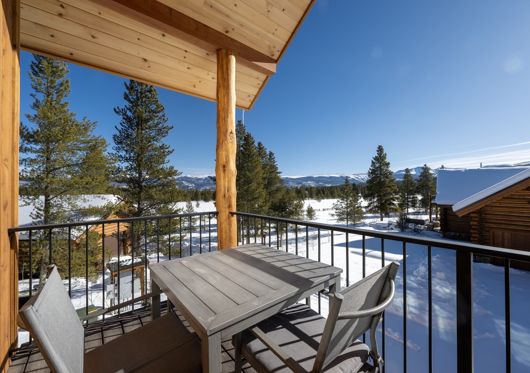 Step onto your private balcony for breathtaking mountain views. Sip morning coffee at your outdoor table while snow-capped peaks frame the horizon.