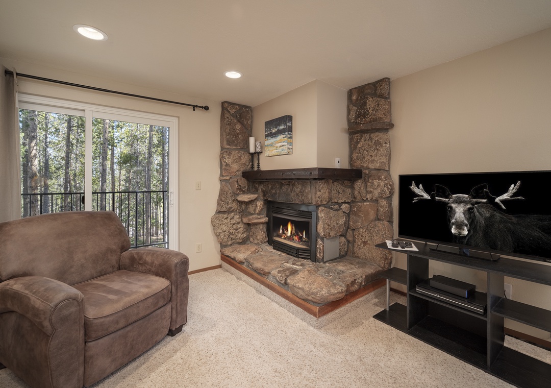 Sink into your favorite leather chair by the crackling stone fireplace while your favorite shows play on the large TV.
