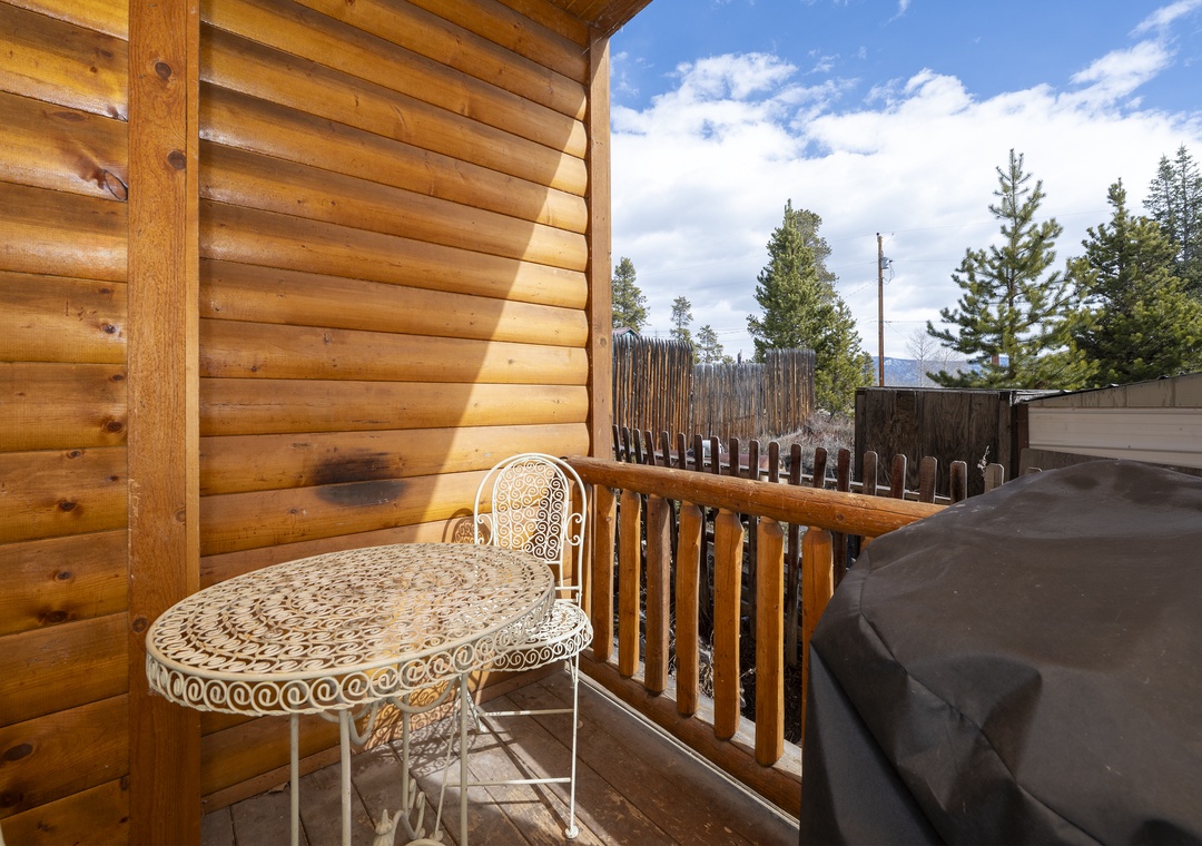 Step onto your private balcony at Granby Lake Shore Estates Townhome 5 where mountain air mingles with the warmth of natural wood, creating the perfect spot for morning coffee.