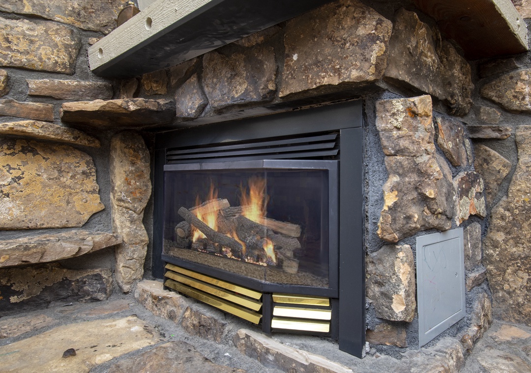 Gather around this beautiful stone fireplace where crackling flames create the perfect ambiance for cozy evenings together.