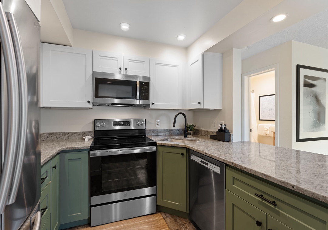 This modern kitchen features stainless steel appliances, granite countertops, and ample storage, making your meal prep convenient and enjoyable.