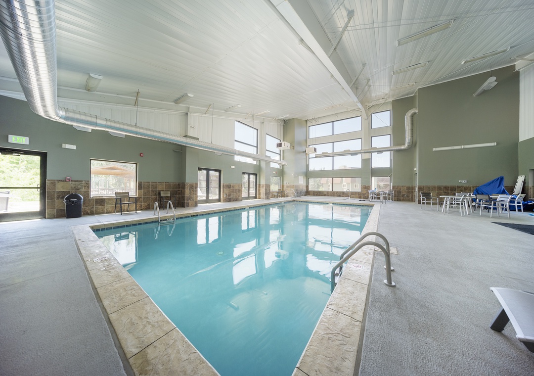 Dive into crystal-clear waters in the clubhouse indoor pool sanctuary, complete with soaring ceilings and abundant natural light for year-round swimming bliss.