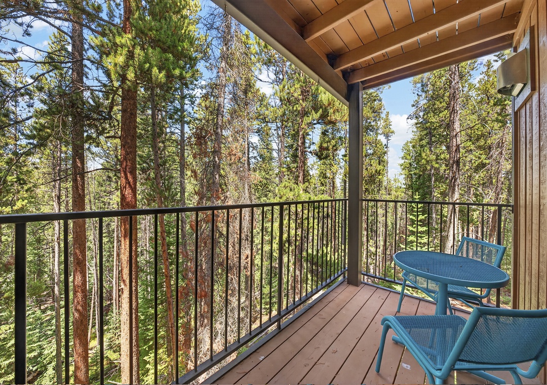 Step onto your private balcony and breathe in the fresh pine-scented air—towering evergreens surround you, creating a peaceful forest retreat where morning coffee feels magical.