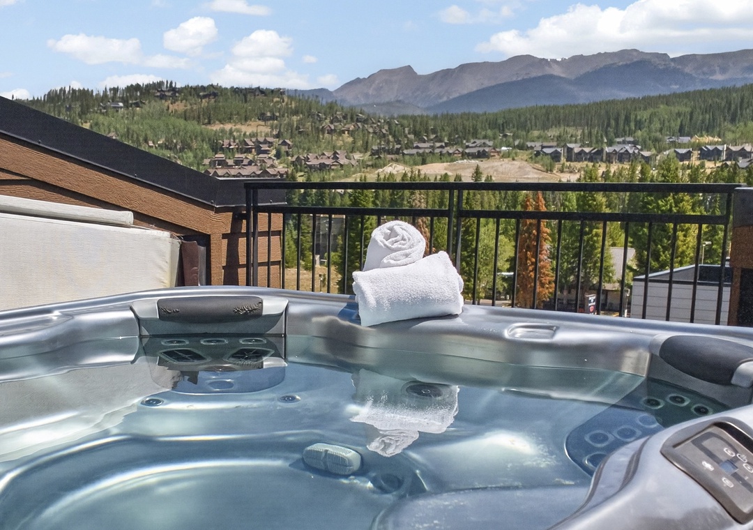 Soak in the warm bubbles of your private hot tub while gazing at stunning mountain peaks and forested valleys stretching endlessly before you—pure alpine bliss.
