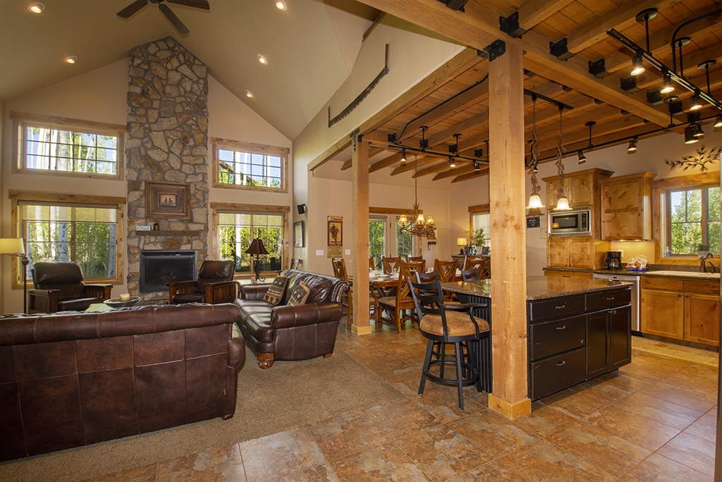 Unwind in this stunning open-concept retreat where rustic beams meet modern comfort. Your gourmet kitchen flows into cozy living spaces.