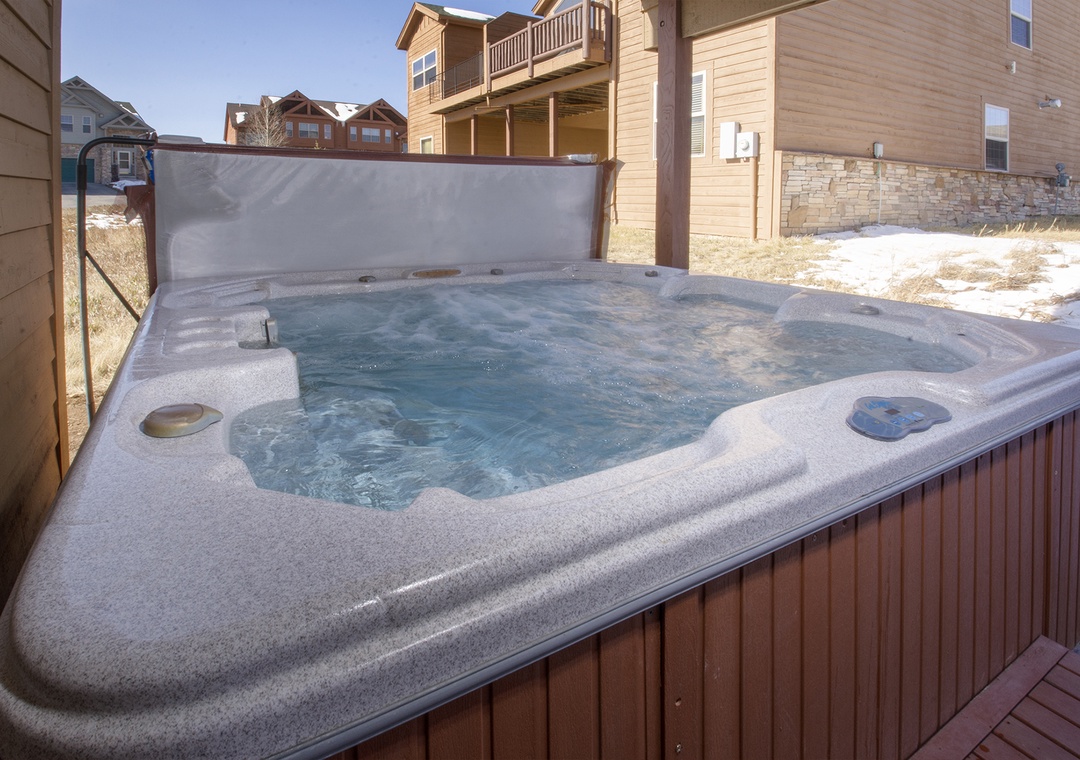 Soak away your worries in your private hot tub, surrounded by mountain views and peaceful neighborhood charm.