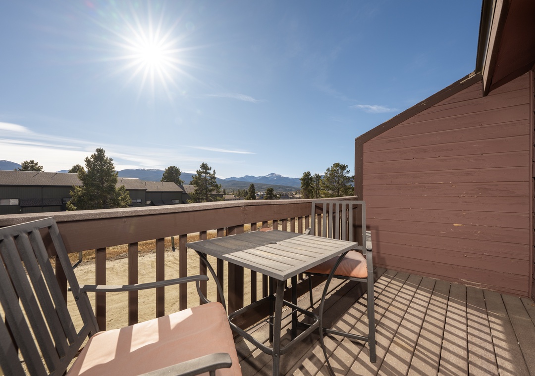 Private balcony with mountain views and outdoor seating for relaxing moments in the fresh air.