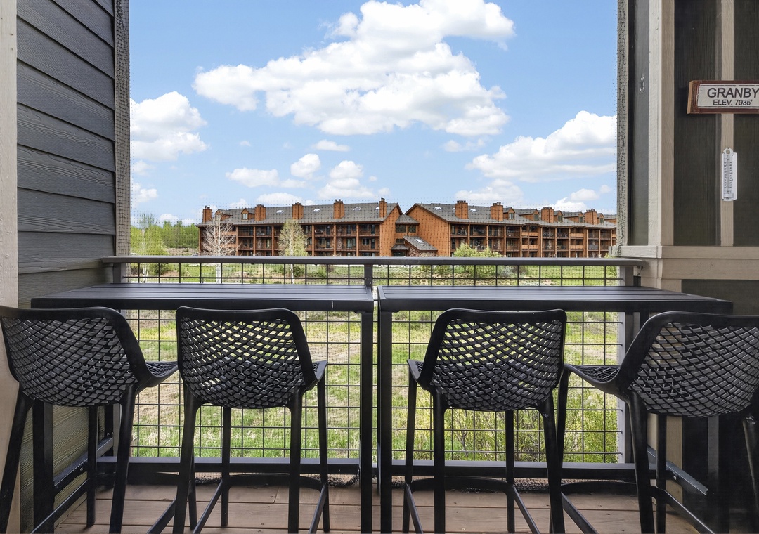 Perched at high elevation, this mountain town balcony offers a peaceful spot to enjoy coffee and watch the clouds drift over the scenic alpine landscape.