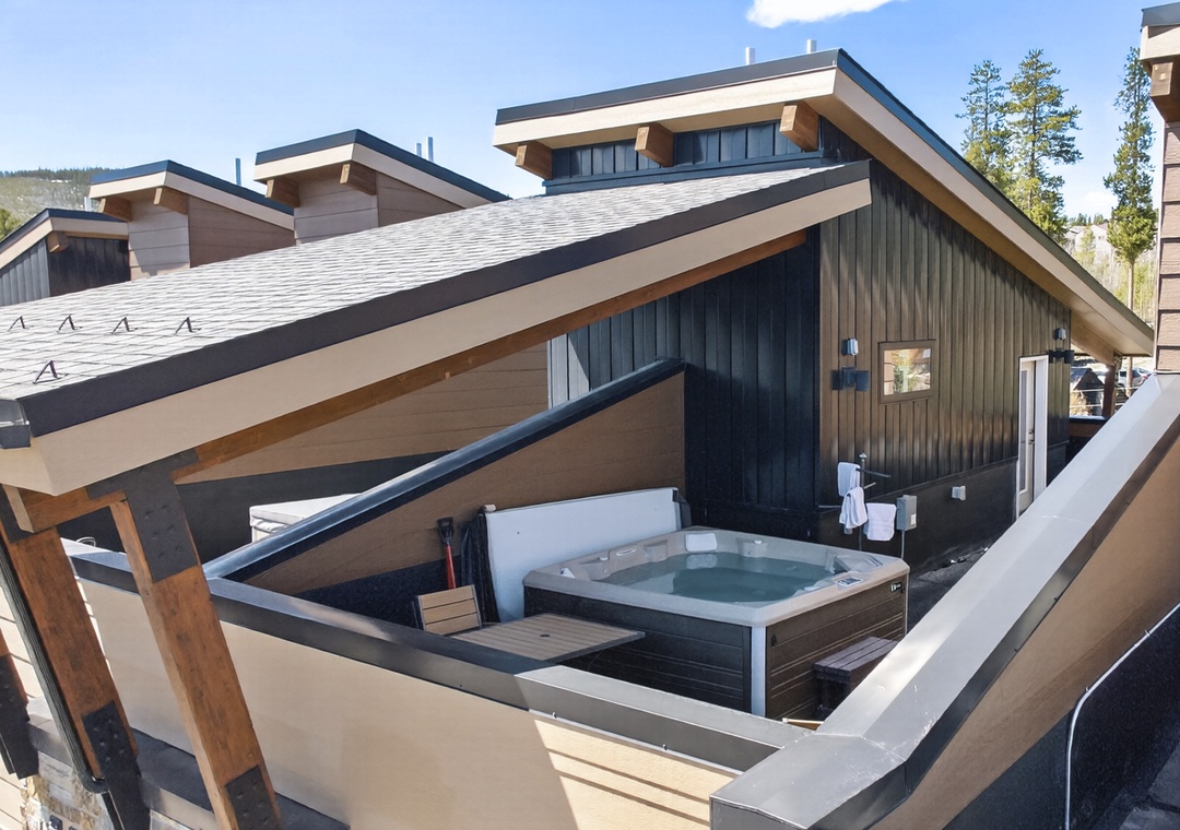 Your private rooftop hot tub awaits with mountain views and fresh alpine air for the perfect evening soak.