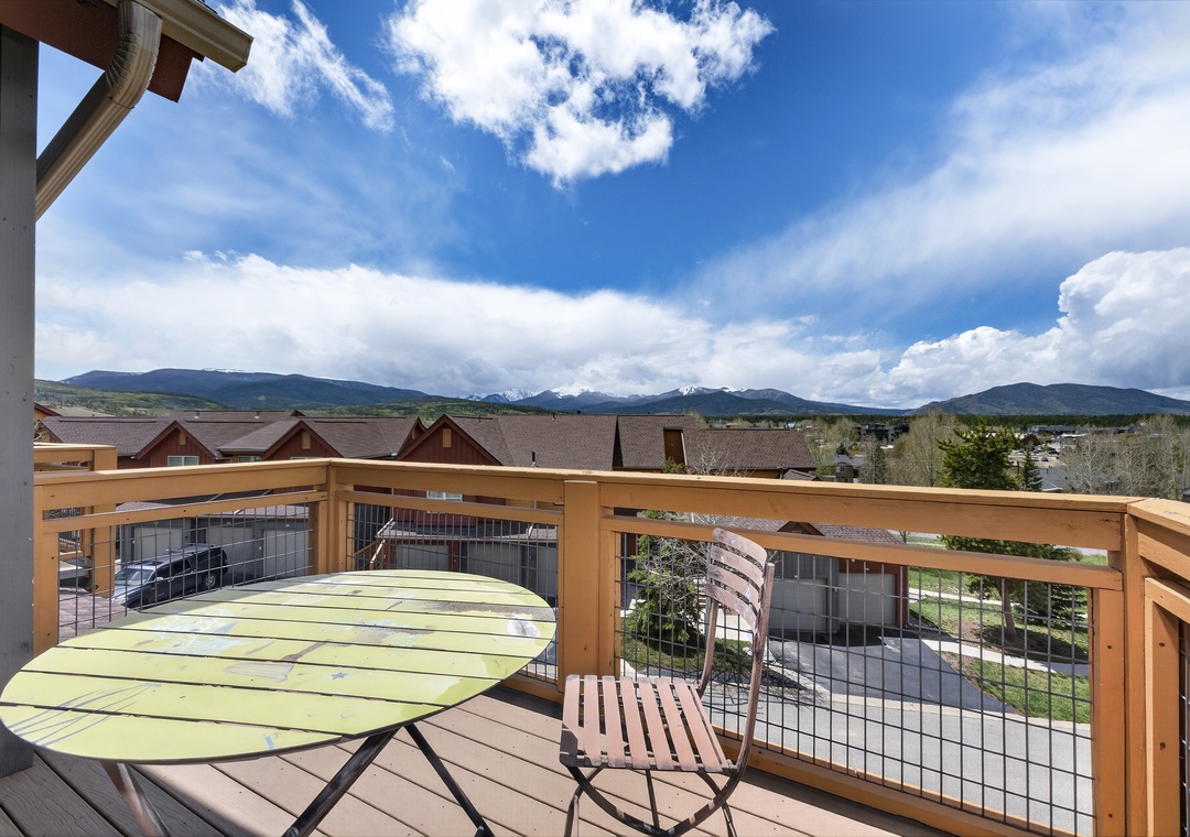 A private balcony featuring sweeping mountain and valley views, perfect for morning coffee or evening sunsets in the fresh alpine air.