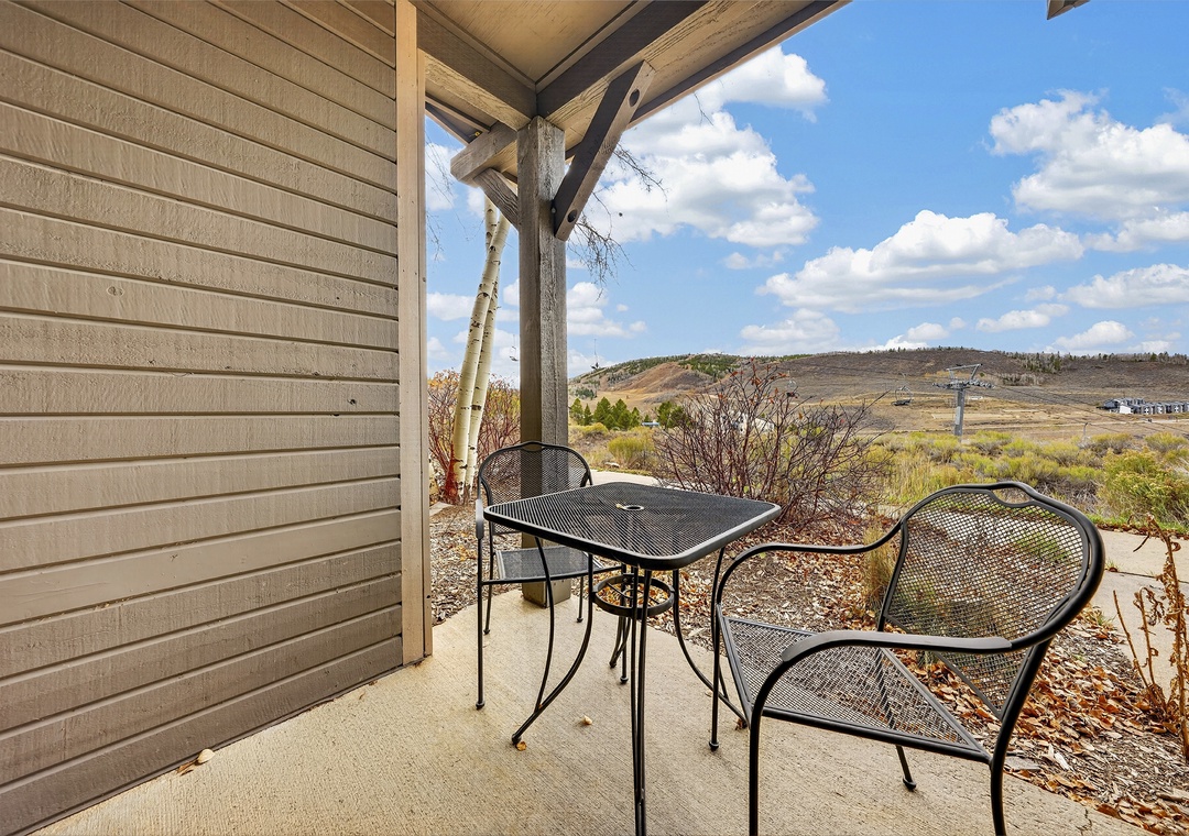 Step onto your private patio and breathe in the fresh mountain air. The sweeping natural landscape stretches before you, offering a peaceful retreat to sip your morning coffee.