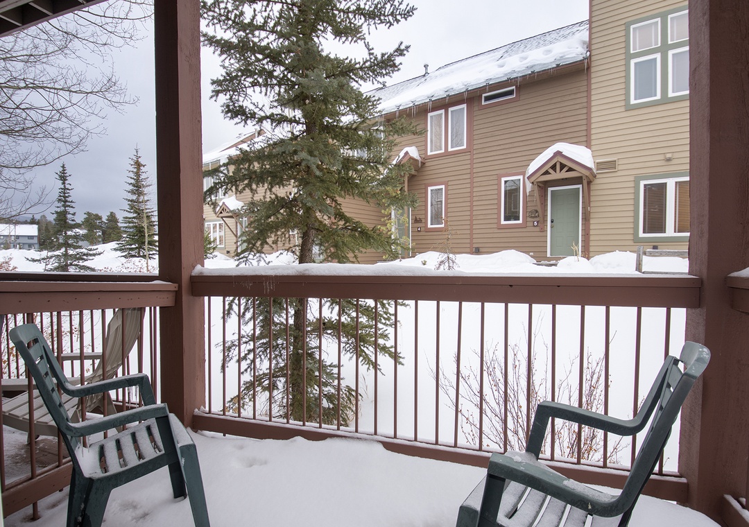 Step onto your private balcony for crisp winter air and peaceful mountain views, with cozy chairs perfect for morning coffee.