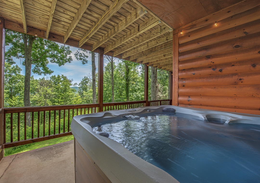 Slip into your private hot tub and let the mountain views and forest air melt your worries away—this is your place to unwind completely.