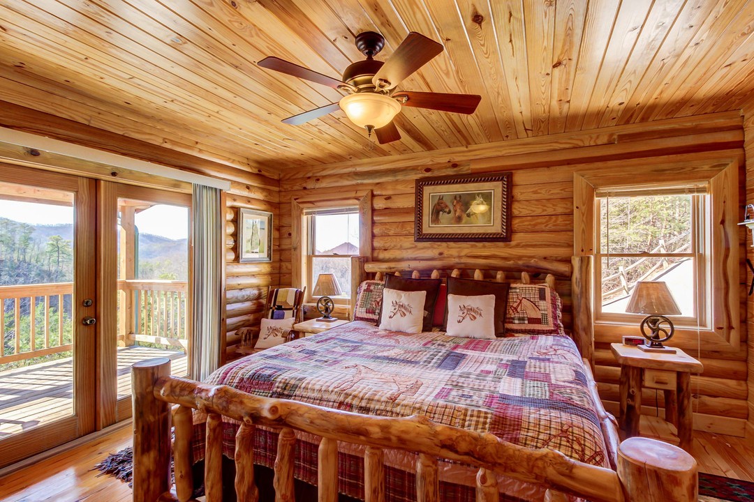 Wake up to stunning mountain vistas from your cozy log bedroom, where rustic charm meets comfort. Step onto your private balcony to breathe in fresh mountain air and soak in the natural beauty.