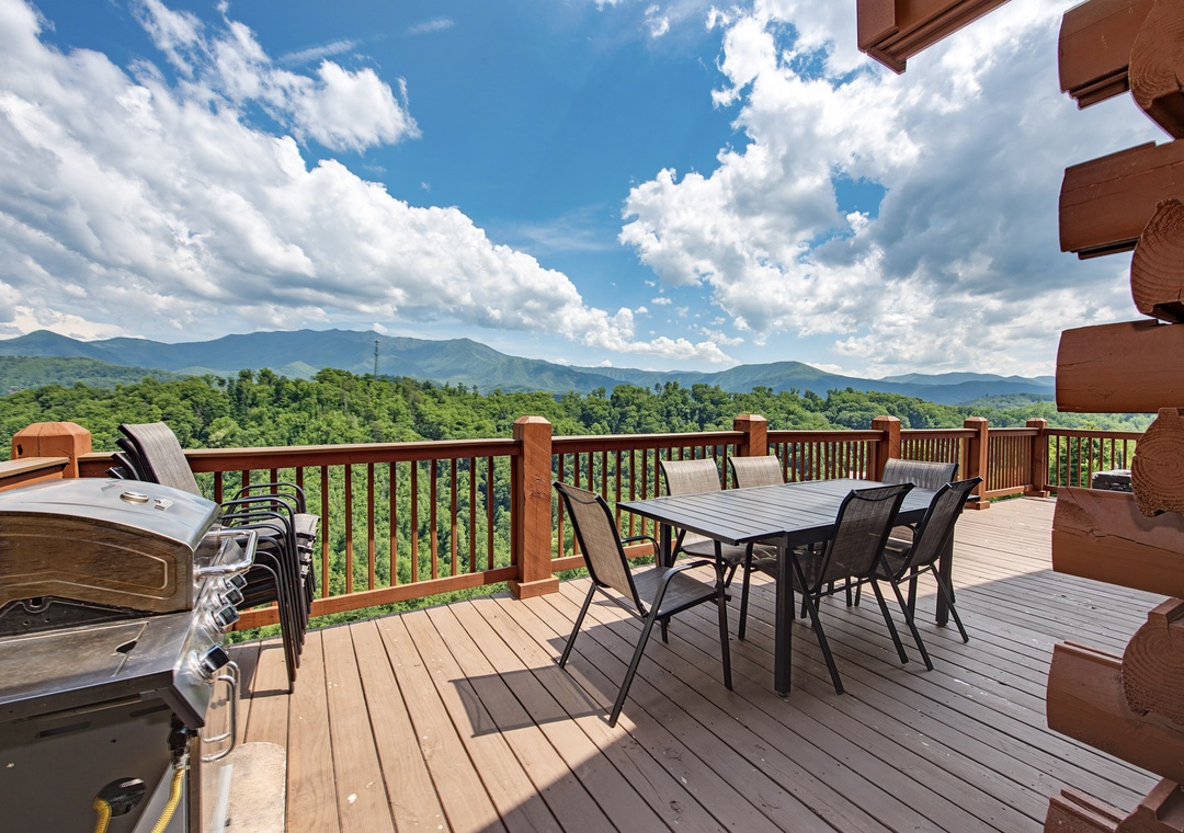 Stunning mountain vistas frame this spacious deck, where your mornings begin with coffee amid panoramic scenery and evenings unwind in the bubbling hot tub under endless skies.