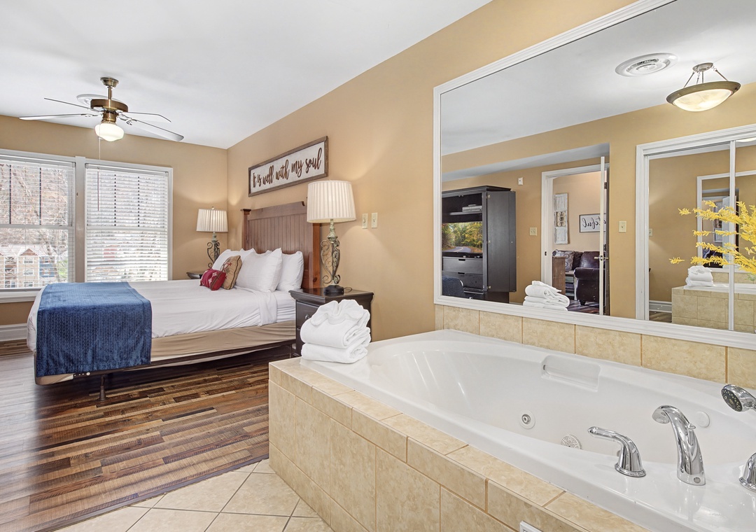 Unwind in your private sanctuary with a king bed, luxurious jetted tub, and cozy sitting area perfect for romantic evenings.