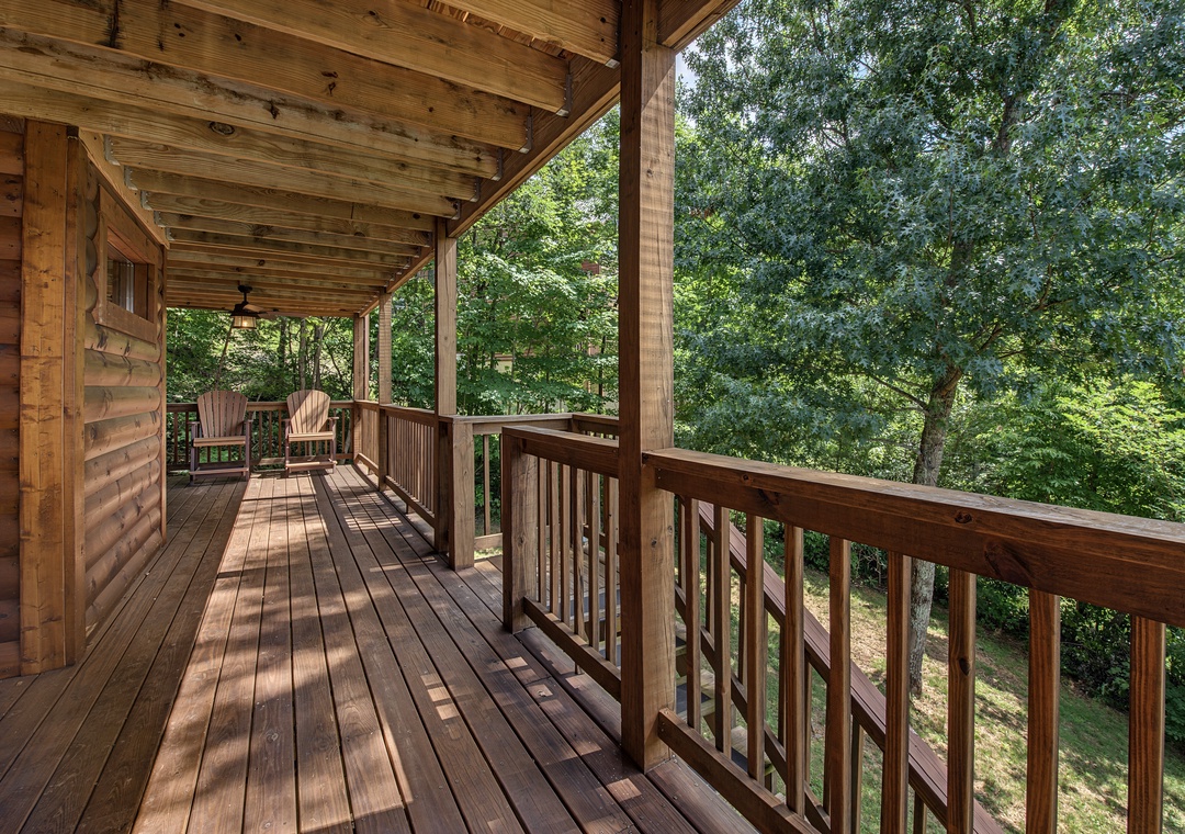 Step onto your private covered deck where peaceful forest views and fresh mountain air create the perfect spot to unwind with morning coffee or evening relaxation.
