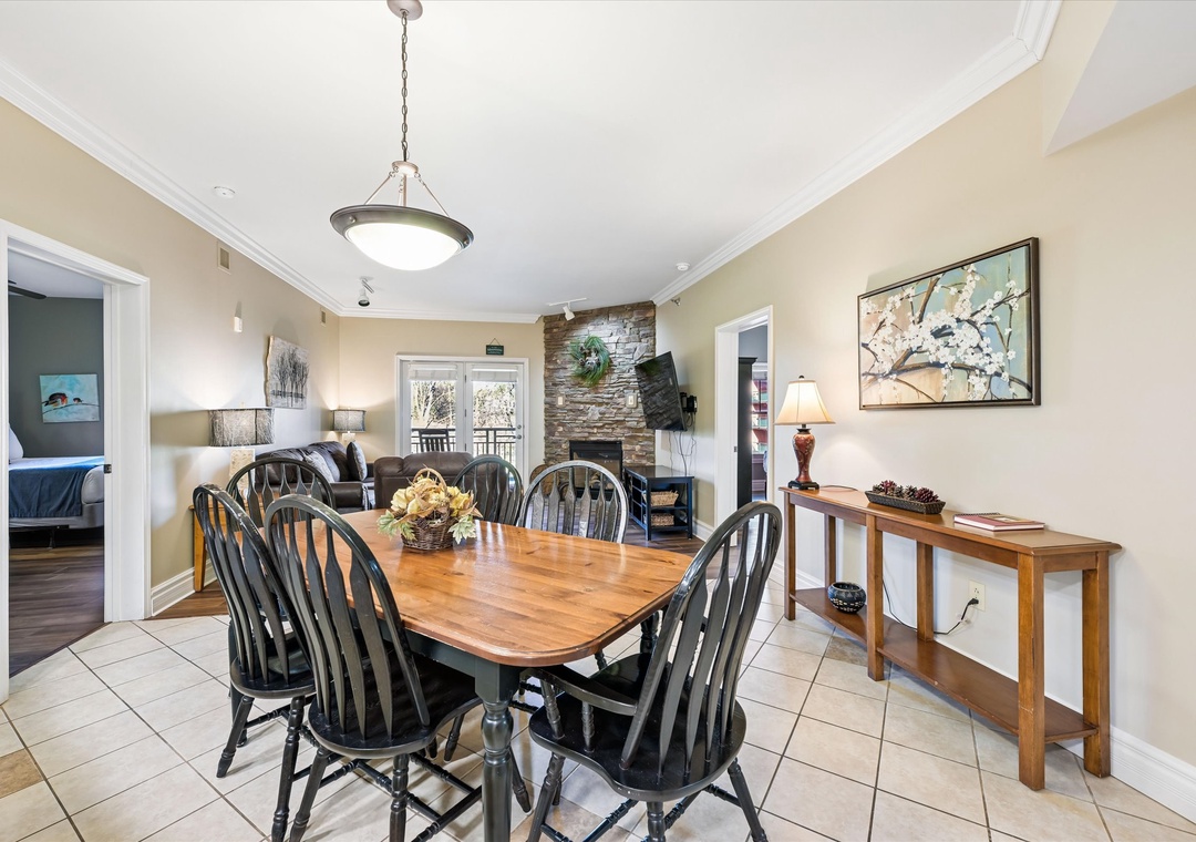 Gather around this beautiful wooden dining table for memorable meals with loved ones in your open-concept space.