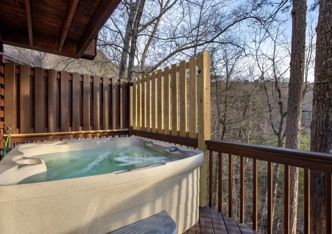 Soak away your worries in your private hot tub surrounded by peaceful forest views and natural wood privacy.