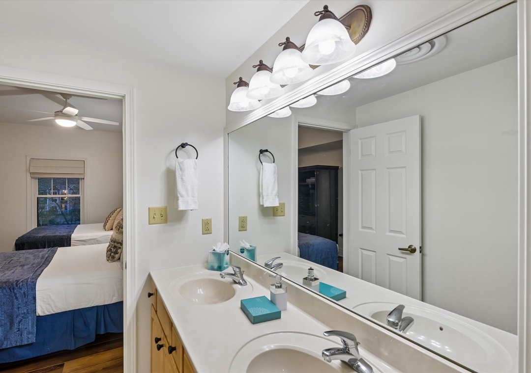 Your private bathroom features dual sinks and quality lighting, perfect for getting ready while sharing the space comfortably.