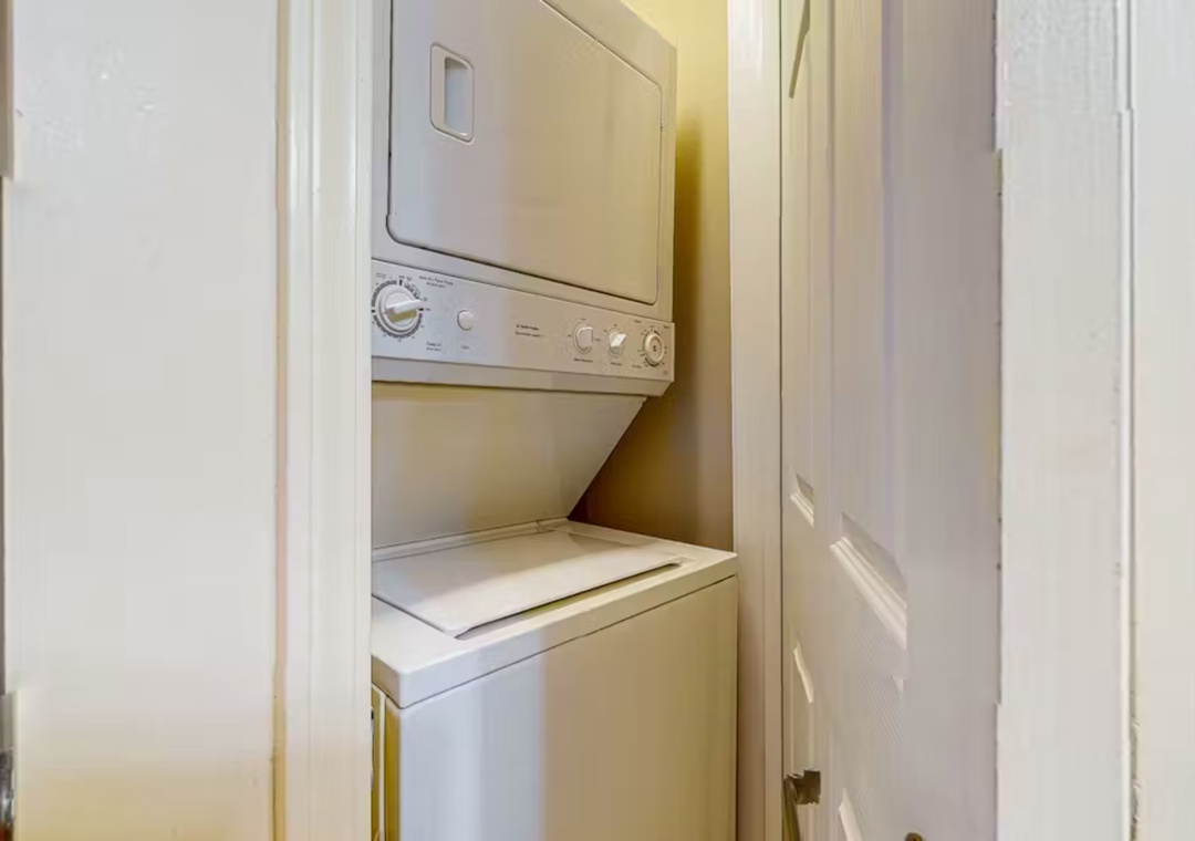Your in-unit washer and dryer combo makes extended stays effortless, tucked neatly in this convenient closet space for your laundry needs.