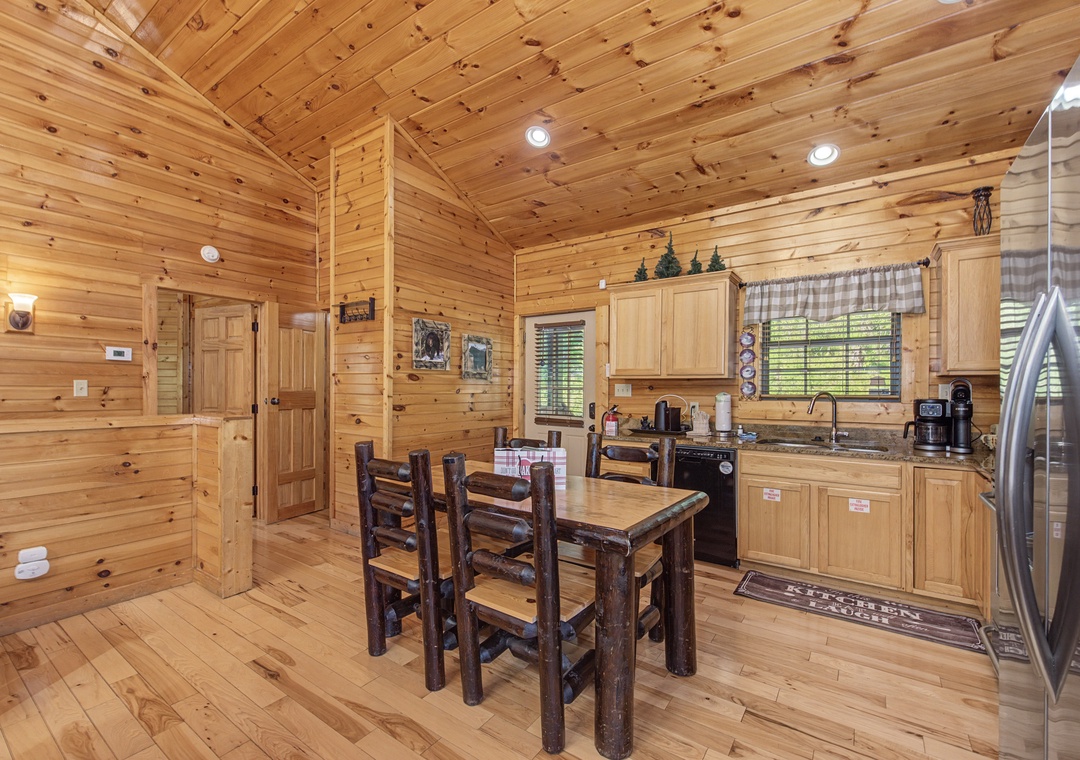 Warm wood surrounds you in this rustic kitchen where morning coffee and hearty meals become cherished cabin memories.