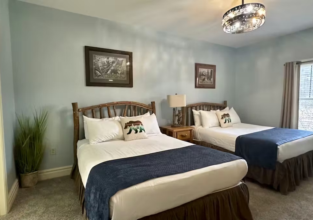 Drift off to sleep in your cozy twin bed sanctuary, featuring plush linens and rustic charm that makes every night feel like home.