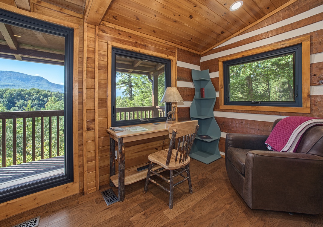 Curl up in your cozy cabin retreat with breathtaking mountain views framing every window—your peaceful escape into nature awaits.
