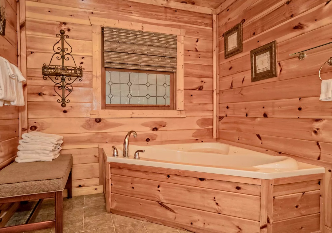 Slip into your private cedar-wrapped soaking tub surrounded by warm wood walls and rustic charm for the ultimate relaxation retreat.