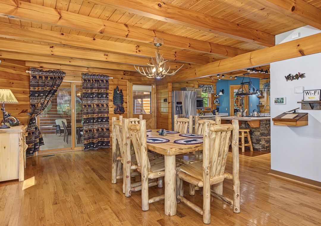 Gather around your handcrafted log dining table under the warmth of vaulted wood ceilings—cozy rustic charm meets mountain lodge elegance for memorable meals together.