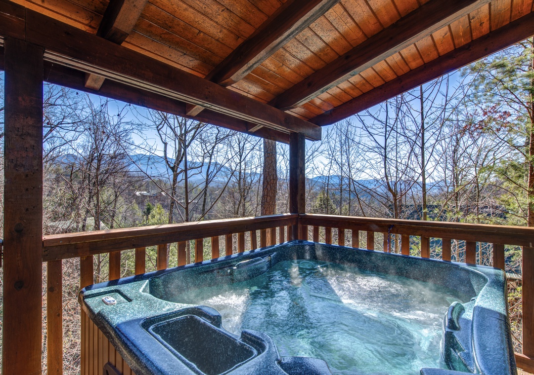 Soak in your private hot tub while taking in breathtaking mountain vistas from your covered deck.